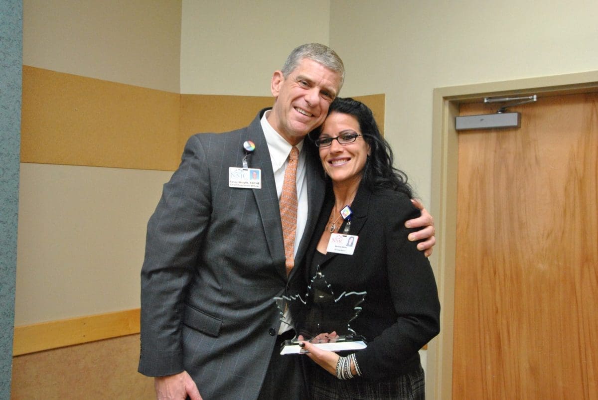 NMC’s President and CEO Peter Wright, FACHE presented the Community Service Award to Melinda White.